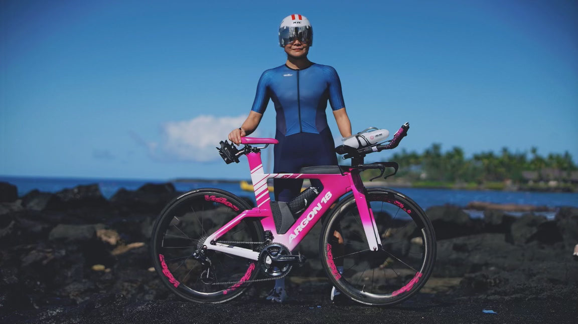 Heidi Wu standing with her bike after competing in the Ironman Kona Hawaii 2023